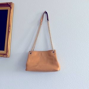 Light brown tan leather Michael Kors purse with adjustable length